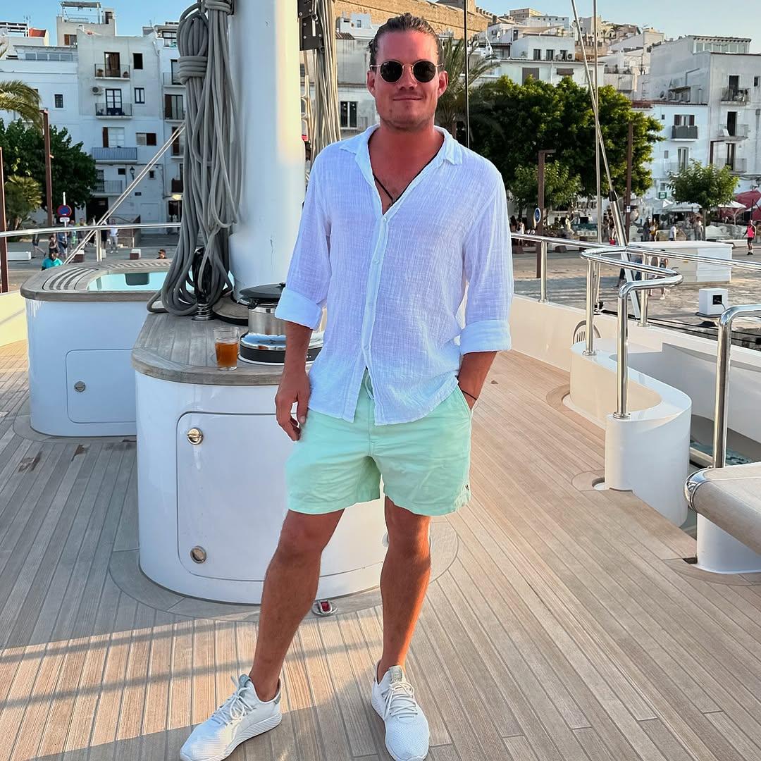 Gary King posing outside on a boat.