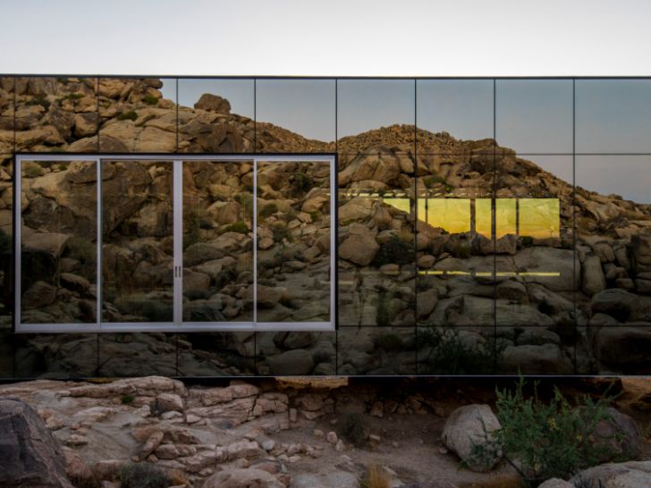 Invisible House with desert reflection in windows