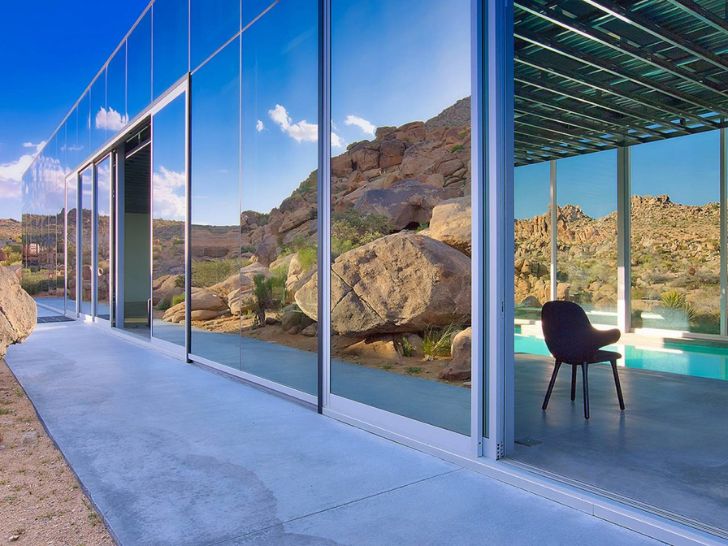 Invisible Home patio with door open to pool